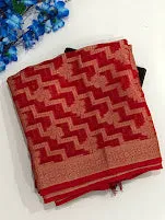 Attractive Red Color Georgette Designer Saree With Flower Motifs And Fancy Tassels