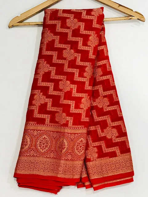 Attractive Red Color Georgette Designer Saree With Flower Motifs And Fancy Tassels