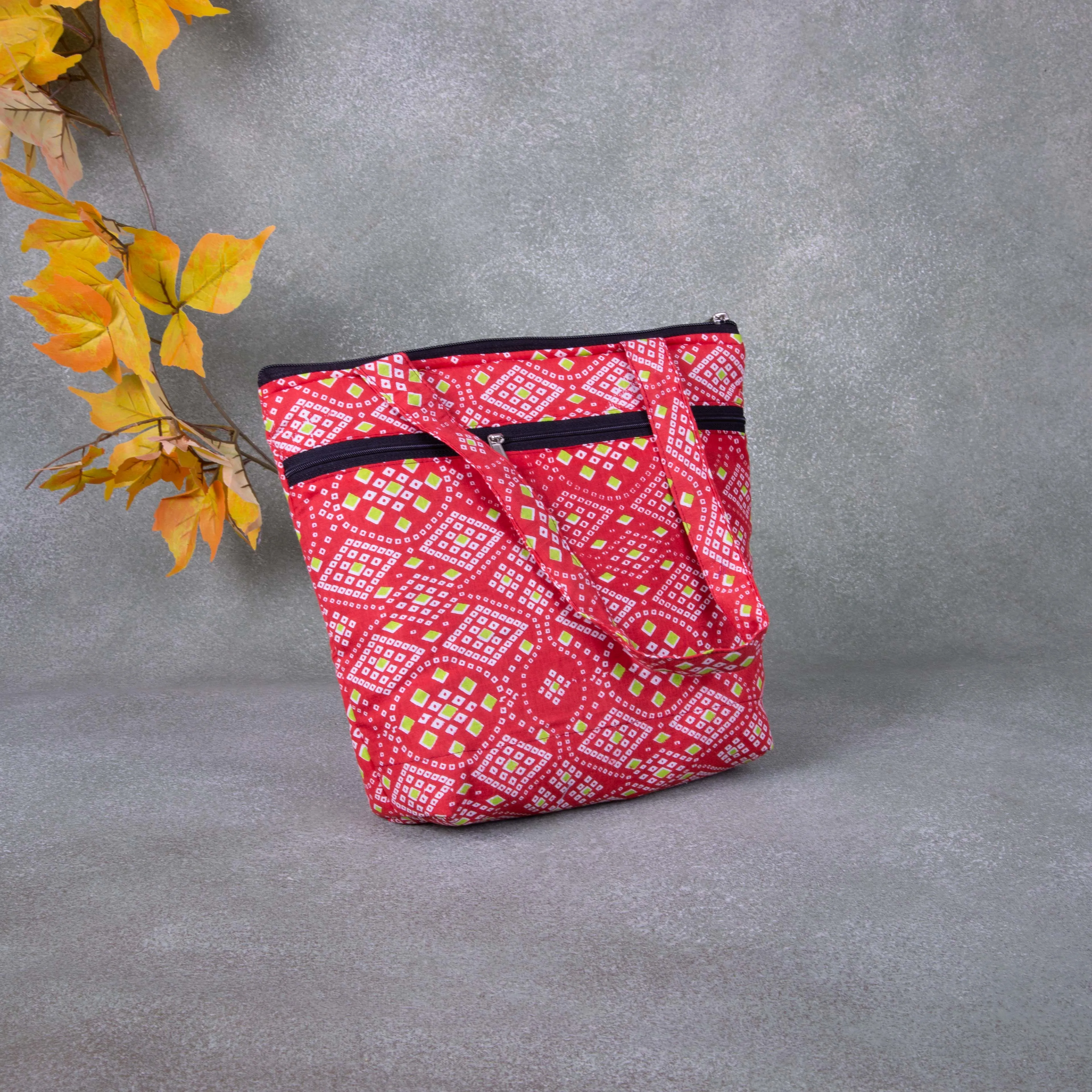 Small Handbag Red Colour with Green Diamond Design.